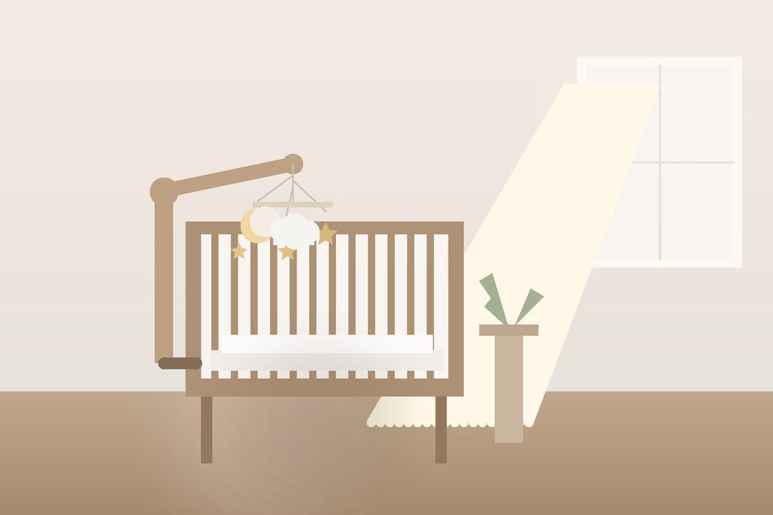 Soft modern nursery with a simple moon and star baby mobile hanging high above a bare crib in gentle morning light